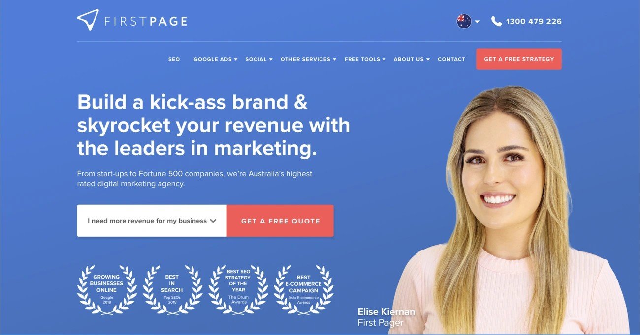 Blue hero banner for First Page: bold headline about building a kick‑ass brand, subheading noting Australia’s top digital marketing agency, a white dropdown and coral 'Get a Free Quote' button on the left, with a smiling blonde woman on the right and award laurels below.
