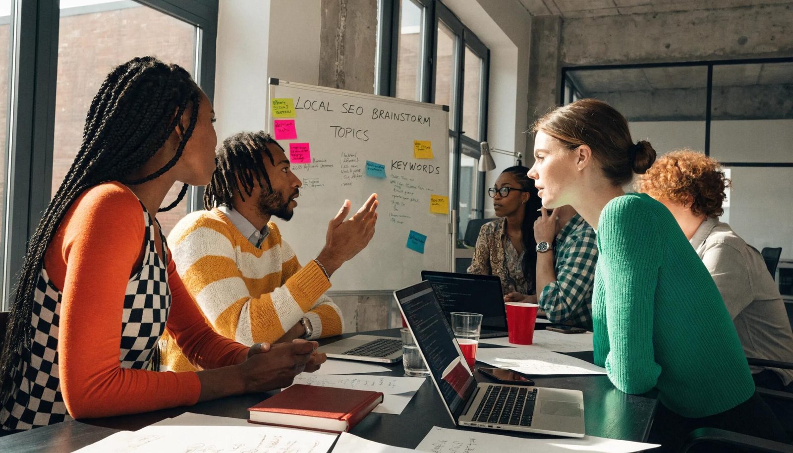 Team brainstorming local SEO strategies in a modern office setting
