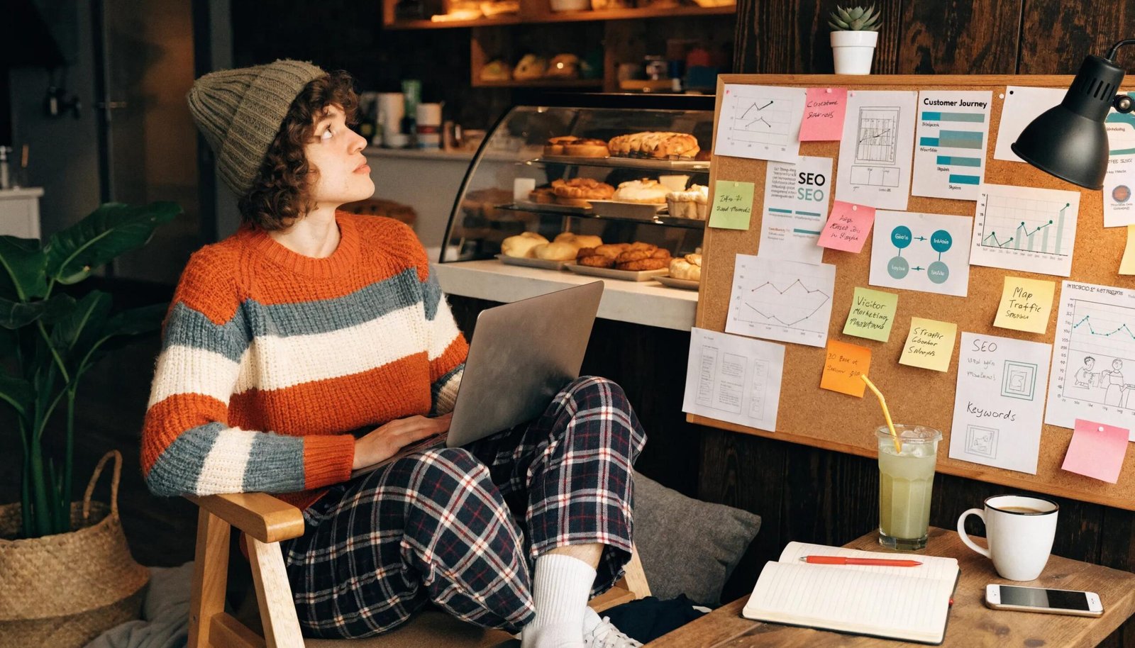 Small business owner analyzing local SEO strategies in a cozy workspace, emphasizing challenges faced.